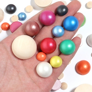 Macro view of assorted 10-30mm half-round wooden beads in various metallic and natural colors