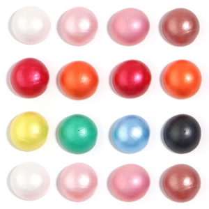 Flat lay of colorful 10-30mm half round wooden beads for DIY jewelry and crafts