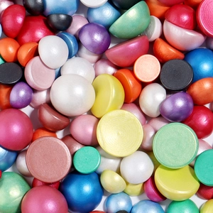 Close-up of assorted colorful pearlescent half-round beads for DIY jewelry making