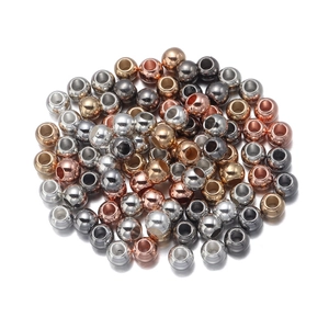 Detailed view of CCB plastic beads in assorted metallic gold and silver colors for DIY jewelry