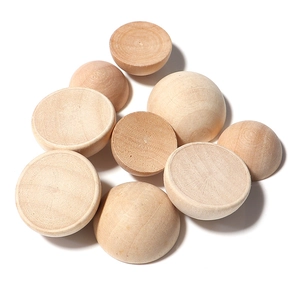 Macro view of smooth natural wood half spheres for DIY crafting and furniture decor