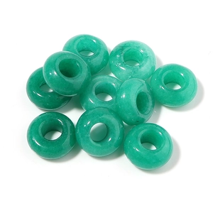 Macro shot of 10 green natural stone donut beads with unique textures for DIY jewelry