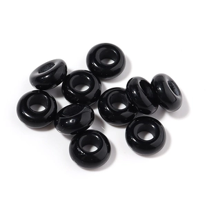 Close-up of polished black large hole beads for DIY jewelry and beaded crafts