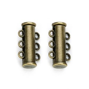 Detail of two antique bronze 3-strand magnetic tube slide clasps for multi-layer jewelry