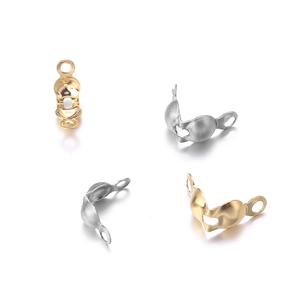 Detail of gold and silver stainless steel fold-over bead covers for DIY jewelry making