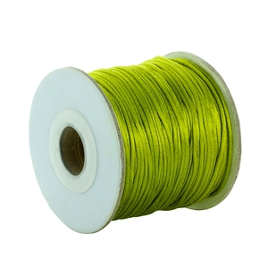 Spool of grass green silk thread for DIY jewelry making and Chinese knot weaving