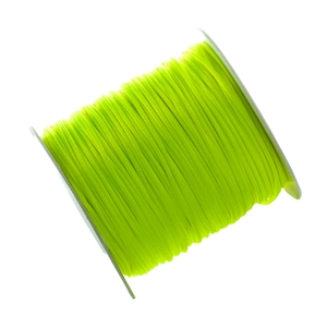 Detail view of fluorescent green weaving cord wound neatly on a white round spool for DIY crafts