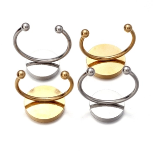 Detailed macro view of gold and silver plated stainless steel ring base DIY components