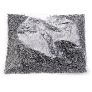 Detailed macro view of gunmetal gray open jump rings in transparent plastic packaging bags