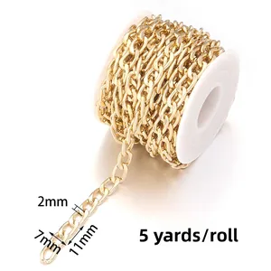 Macro detail of golden 11x7mm aluminum chain link with size specs for DIY bag making