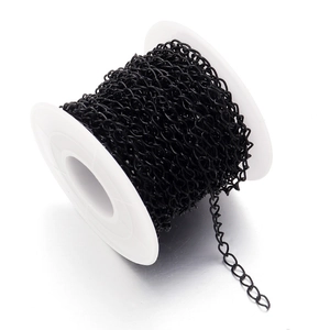 Matte black metal twist chain on a white spool for DIY jewelry and garment accessory