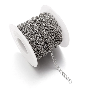 Silver stainless steel extension chain roll for DIY jewelry making on white spool