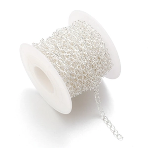 Silver metal DIY jewelry chain roll on white spool for handcrafted jewelry making