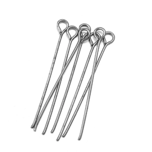Detailed view of silver-tone metal eye pins with round loops for jewelry making and DIY crafts