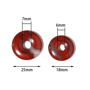 Detail of red jasper donut pendants in 18mm and 25mm sizes with natural mottled texture