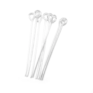 Macro shot of silver plated metal eye pins for DIY jewelry making and beading tasks