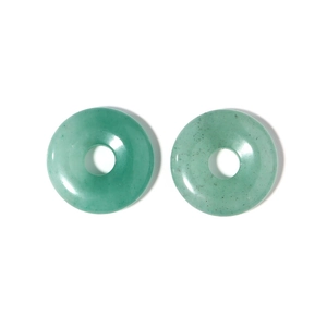 Close-up of two polished green agate donut pendants with smooth edges for DIY jewelry