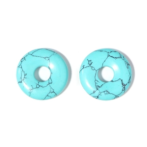 Detailed view of light blue turquoise flat donut charms with natural black marble veins