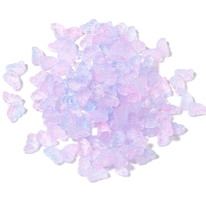 Detail of colorful butterfly-shaped translucent glass beads with iridescent gradient finish