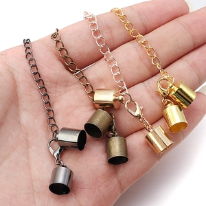 Detail of four-color lobster clasps and cord end caps on hand for DIY jewelry making