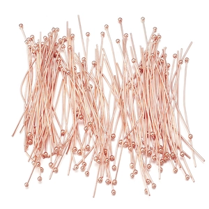 Detailed view of rose gold plated ball pins for DIY jewelry making and bead threading