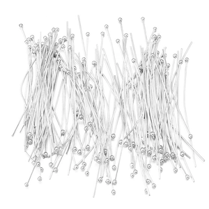 Macro shot of bulk silver metal ball head pins for professional DIY jewelry crafting