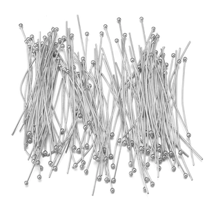 Macro shot of silver ball head pins for jewelry making and DIY beading accessories