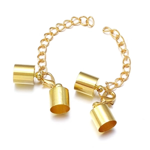 Detail of gold lobster clasps and cylinder end caps for DIY jewelry making