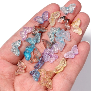 Macro shot of colorful aurora butterfly glass beads for DIY jewelry and hair accessories