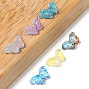 Macro shot of colorful transparent butterfly beads for DIY jewelry making with fine texture