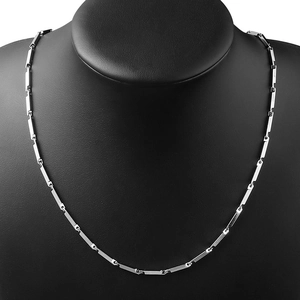 Minimalist silver stainless steel cuban chain necklace displayed on a black mannequin