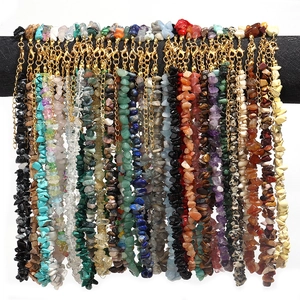 Detailed view of natural agate and crystal chip stone necklaces with golden lobster clasps