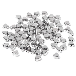 Macro view of silver plated heart-shaped CCB beads with side holes for DIY jewelry