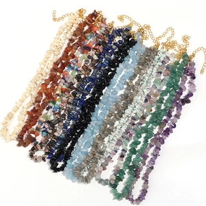 Detail of natural crushed stone necklaces in multi-colors with gold lobster clasps