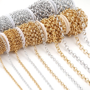 Detailed view of gold and silver rolo chains on spools for DIY jewelry making