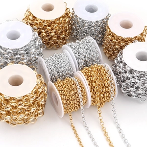 Macro detail of gold and silver plated cross chains on spools for DIY jewelry making