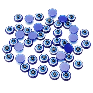 Macro view of blue resin evil eye flatback cabochons for DIY jewelry making and crafts