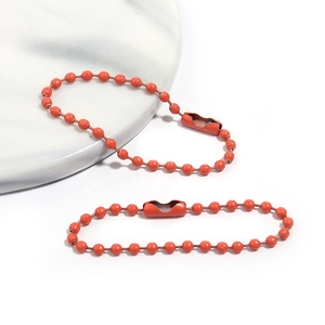 Vue détaillée de la chaîne à billes en métal orange de 12cm avec fermoir pour bricolage