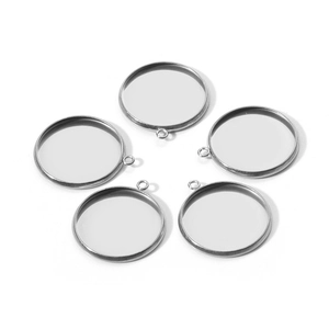 Detailed view of 5 silver stainless steel circular bezel charms for DIY jewelry making