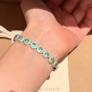 Sparkling green zircon tennis bracelet for women featuring luxury silver-plated setting.