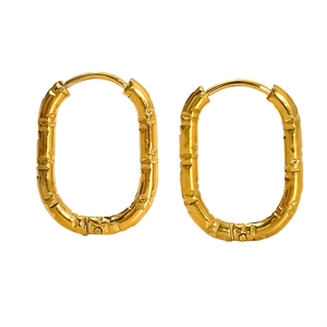 Elegant oval gold hoop earrings with irregular textured bamboo-style design for women