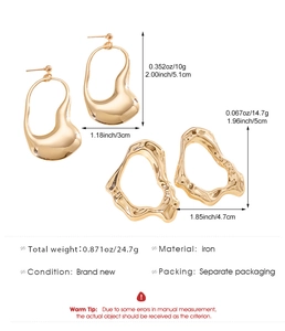 Detail view of irregular gold-plated geometric hoop earrings with precise dimensions