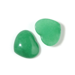 Macro detail of two heart-shaped green aventurine quartz stones with polished finish