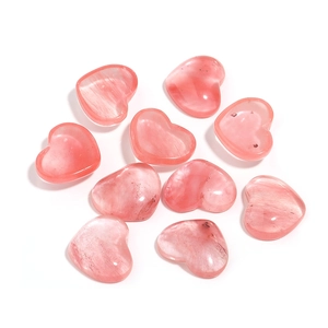 Detailed macro view of ten heart-shaped pink quartz stones showing natural textures