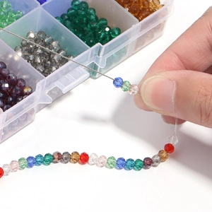 Multi-colored faceted crystal glass beads set with clear plastic organizer box