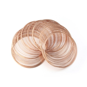 Macro shot of rose gold memory wire loops for DIY bracelet and jewelry making