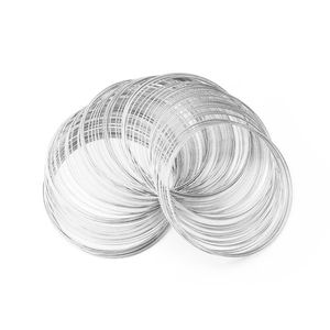 Close-up of silver memory wire coils for DIY jewelry making with metallic luster
