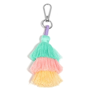 Detail of macaron triple layered cotton tassel with silver metal clasp and purple cord