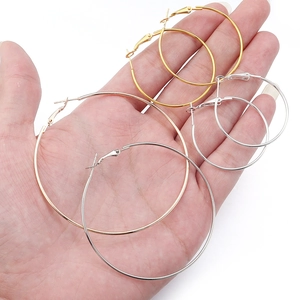 Classic round metal hoop earrings in gold, silver and rose gold shown in various sizes