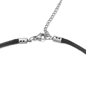 Detailed macro view of adjustable stainless steel lobster clasp and cord end for jewelry